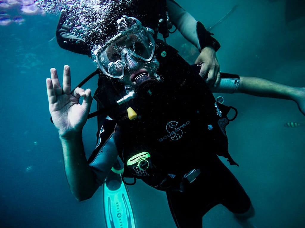 phi-phi-cabana-try-scuba-diving-b-crop A diver being rescued during the rescue diver course. He is showing the ok sign to inform that he is doing good and responsive.
