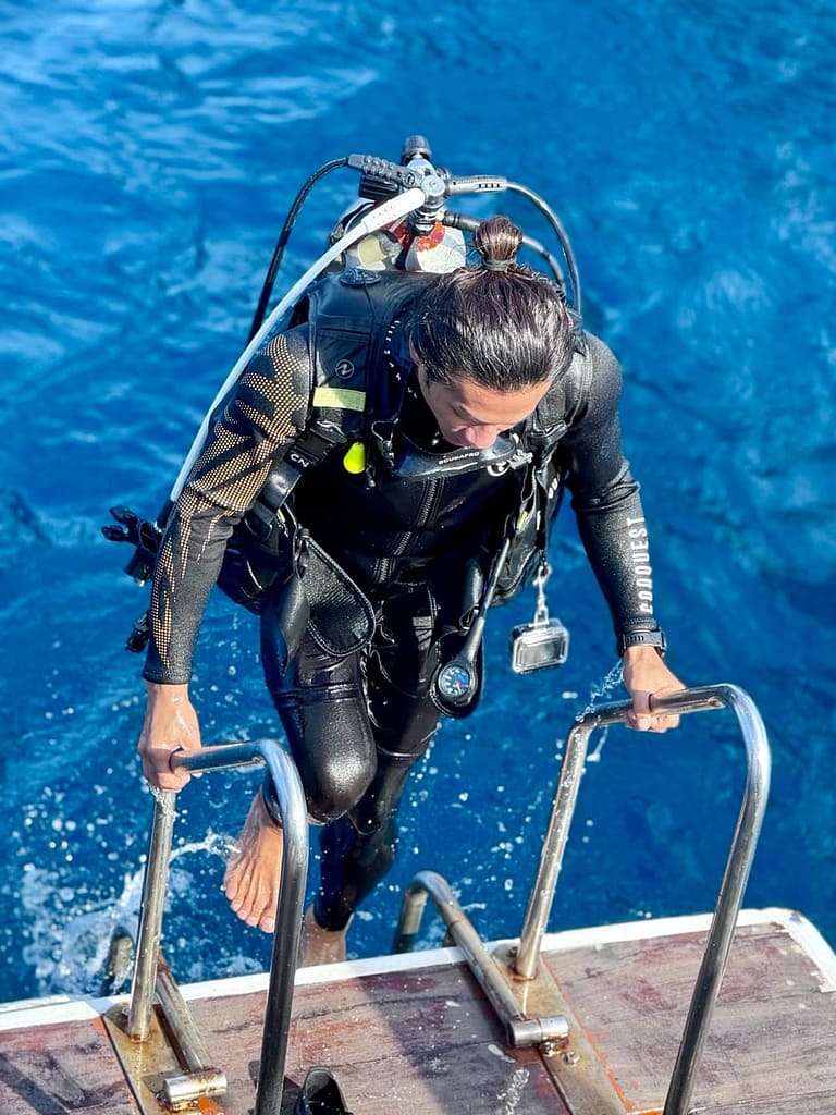 phi-phi-cabana-diving-divemaster-02 A experienced diver coming out of the water after a 30 min diving underwater of Phi Phi Island